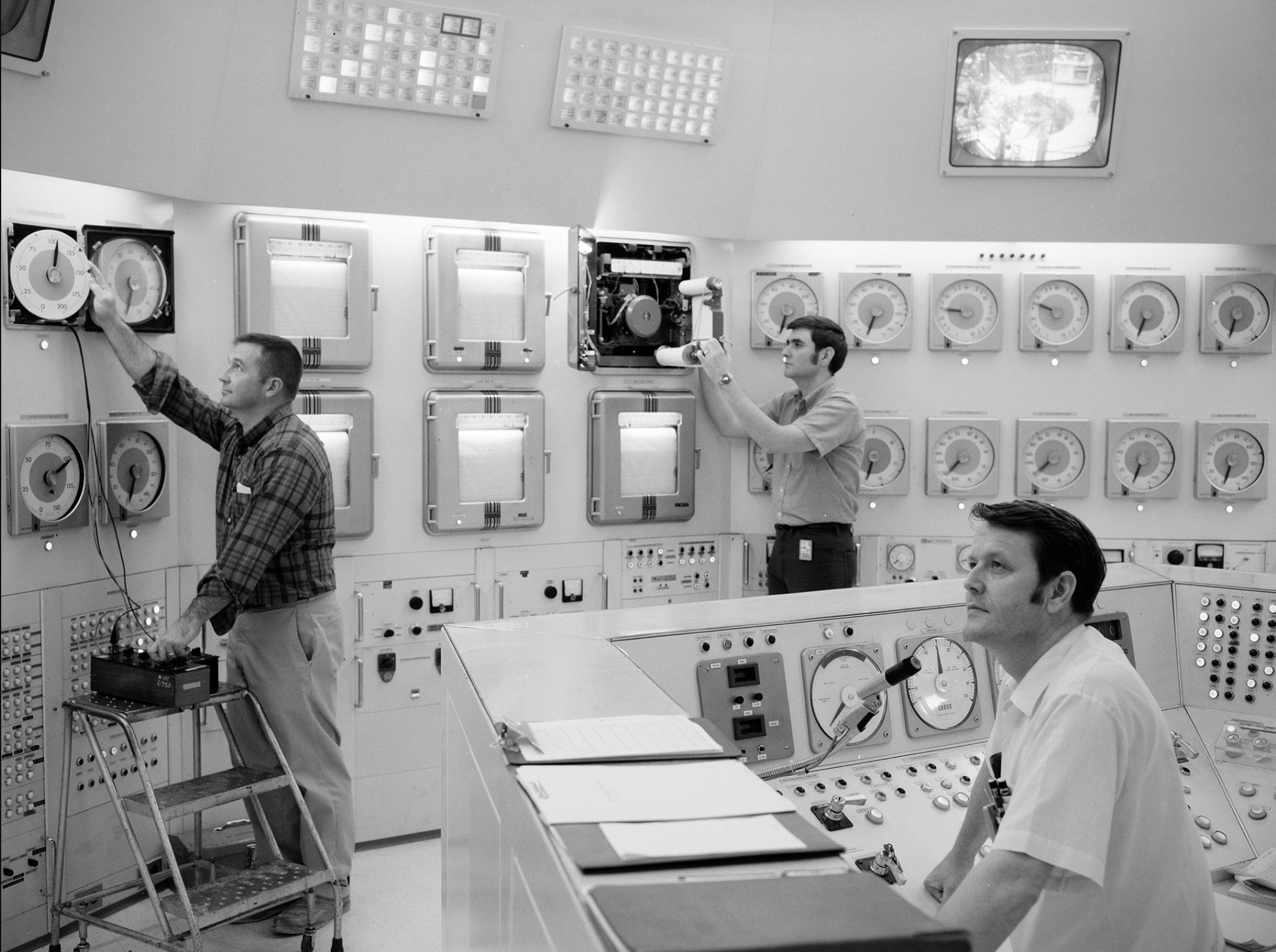 Donald Rhodes and Clyde Greer monitor the operation of the Plum Brook Reactor Facility from the control room 